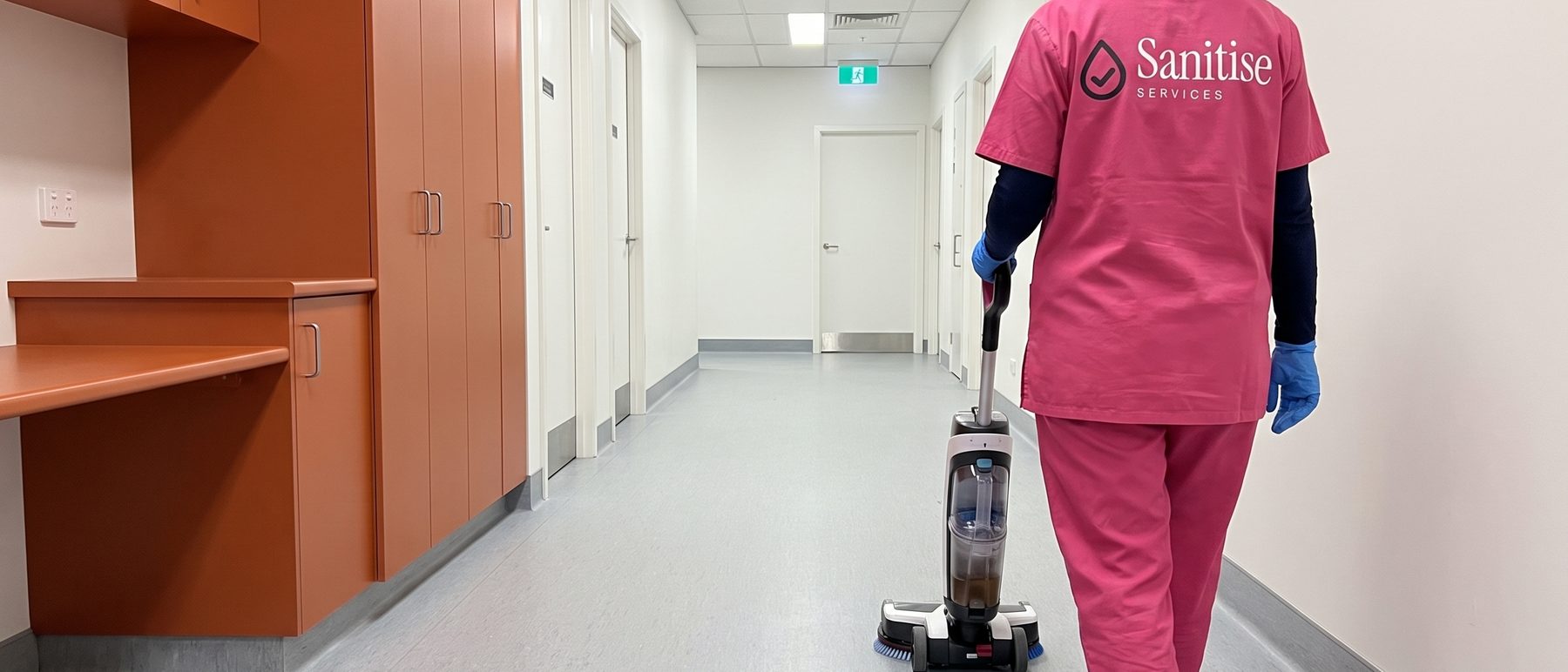 Cleaning a clinic corridor floor